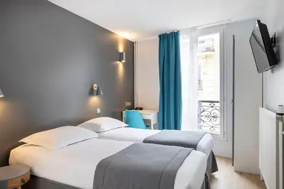 Un ou plusieurs lits dans un hébergement de l'établissement Paris Legendre