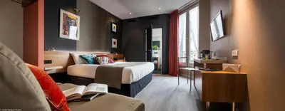 Un ou plusieurs lits dans un hébergement de l'établissement Fred'Hotel