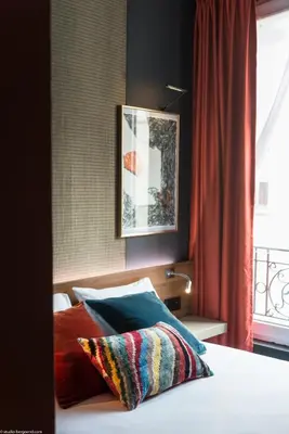 Un ou plusieurs lits dans un hébergement de l'établissement Fred'Hotel