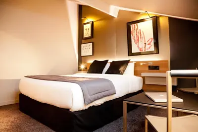 Un ou plusieurs lits dans un hébergement de l'établissement Fred'Hotel