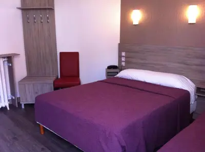 Un ou plusieurs lits dans un hébergement de l'établissement Grand Hôtel Magenta