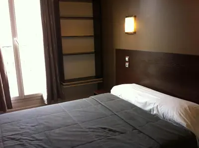 Un ou plusieurs lits dans un hébergement de l'établissement Grand Hôtel Magenta