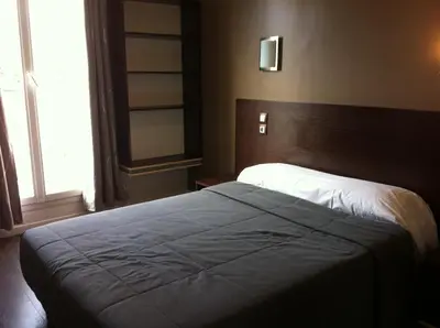 Un ou plusieurs lits dans un hébergement de l'établissement Grand Hôtel Magenta