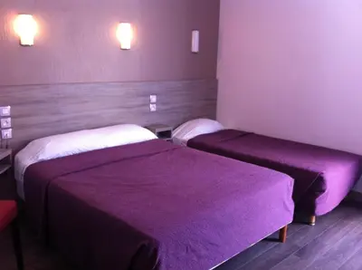 Un ou plusieurs lits dans un hébergement de l'établissement Grand Hôtel Magenta