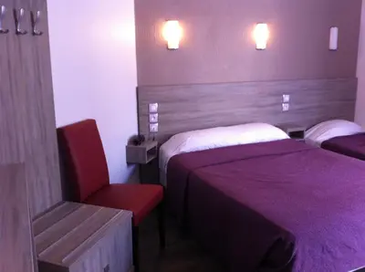 Un ou plusieurs lits dans un hébergement de l'établissement Grand Hôtel Magenta