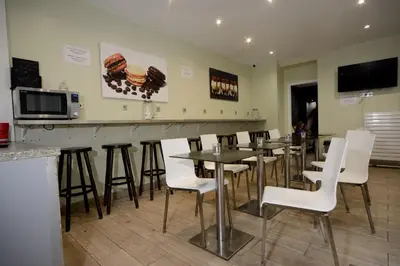 Télévision ou salle de divertissement dans l'établissement Enjoy Hostel