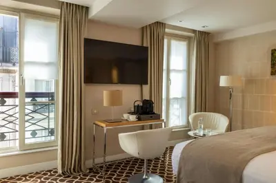 Un ou plusieurs lits dans un hébergement de l'établissement Hôtel Le Pradey