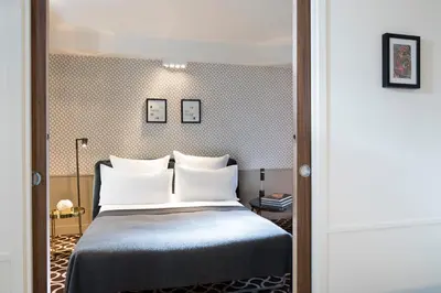 Un ou plusieurs lits dans un hébergement de l'établissement Hôtel Le Pradey