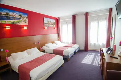 Un ou plusieurs lits dans un hébergement de l'établissement Hotel Paris Bruxelles