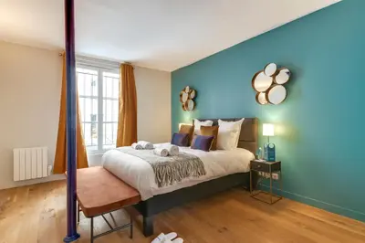 Un ou plusieurs lits dans un hébergement de l'établissement Sweett - Villa Montorgueil