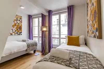 Un ou plusieurs lits dans un hébergement de l'établissement Sweett - Villa Montorgueil