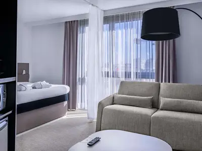 Un ou plusieurs lits dans un hébergement de l'établissement Novotel Suites Paris Issy Les Moulineaux