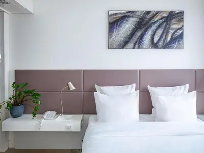 Un ou plusieurs lits dans un hébergement de l'établissement Novotel Suites Paris Issy Les Moulineaux