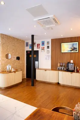Coin salon dans l'établissement Hôtel Tilde