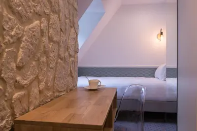Un ou plusieurs lits dans un hébergement de l'établissement Hôtel Tilde