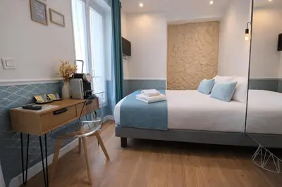 Un ou plusieurs lits dans un hébergement de l'établissement Hôtel Tilde