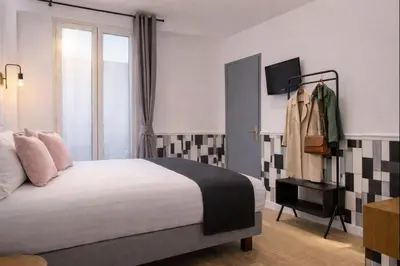 Un ou plusieurs lits dans un hébergement de l'établissement Hôtel Tilde