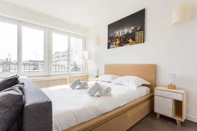 Un ou plusieurs lits dans un hébergement de l'établissement Cosy studio 4P Trocadero-Eiffel Tower