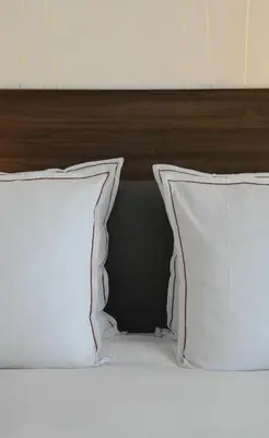 Un ou plusieurs lits dans un hébergement de l'établissement Hôtel Jules & Jim
