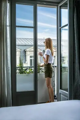 Un ou plusieurs lits dans un hébergement de l'établissement Hotel Flanelles Paris