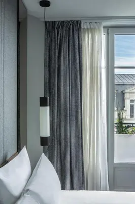 Un ou plusieurs lits dans un hébergement de l'établissement Hotel Flanelles Paris