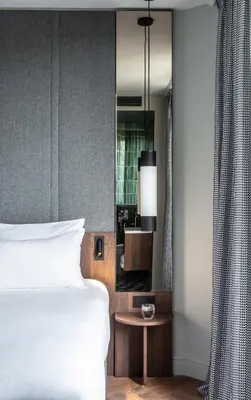 Un ou plusieurs lits dans un hébergement de l'établissement Hotel Flanelles Paris