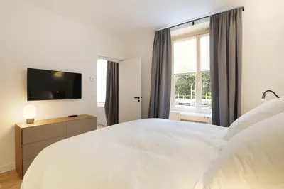Un ou plusieurs lits dans un hébergement de l'établissement Pick A Flat's Apartment in Saint Germain - Rue Corneille