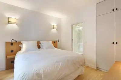 Un ou plusieurs lits dans un hébergement de l'établissement Pick A Flat's Apartment in Saint Germain - Rue Corneille