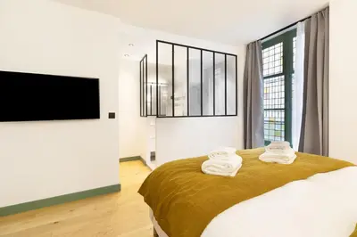 Un ou plusieurs lits dans un hébergement de l'établissement Pick A Flat's Apartment in Saint Germain - Rue Corneille
