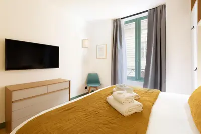 Un ou plusieurs lits dans un hébergement de l'établissement Pick A Flat's Apartment in Saint Germain - Rue Corneille