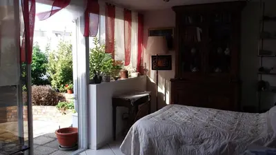 Un ou plusieurs lits dans un hébergement de l'établissement Chambres d'hôtes Issy-Paris