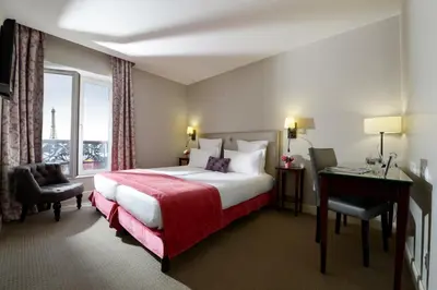 Un ou plusieurs lits dans un hébergement de l'établissement Hôtel Le Relais Saint Charles