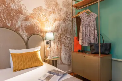 Un ou plusieurs lits dans un hébergement de l'établissement Appart Hotel Avalon