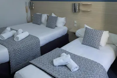 Un ou plusieurs lits dans un hébergement de l'établissement Hôtel de Paris La Défense