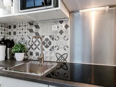 Cuisine ou kitchenette dans l'établissement Montmartre Apartments Matisse