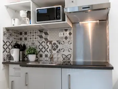 Cuisine ou kitchenette dans l'établissement Montmartre Apartments Matisse