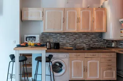 Cuisine ou kitchenette dans l'établissement Havre de Paix Jacuzzi