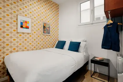 Un ou plusieurs lits dans un hébergement de l'établissement Edgar Suites Marais - Réaumur