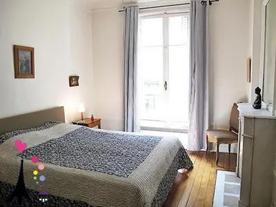 Un ou plusieurs lits dans un hébergement de l'établissement Champs Elysees Argentine CityCosy