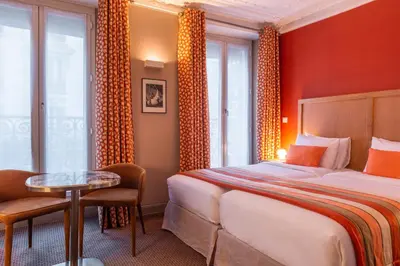 Un ou plusieurs lits dans un hébergement de l'établissement Hotel 29 Lepic