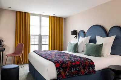 Un ou plusieurs lits dans un hébergement de l'établissement Hôtel Maxim Opéra