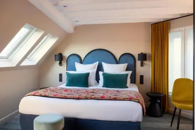 Un ou plusieurs lits dans un hébergement de l'établissement Hôtel Maxim Opéra
