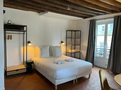 Un ou plusieurs lits dans un hébergement de l'établissement Conde Chic Studio