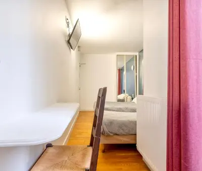 Un ou plusieurs lits dans un hébergement de l'établissement Hotel de Nantes