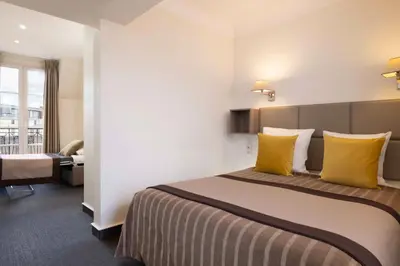 Un ou plusieurs lits dans un hébergement de l'établissement Hôtel Saint Pierre