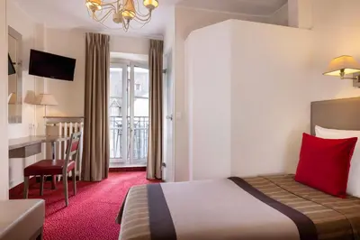 Un ou plusieurs lits dans un hébergement de l'établissement Hôtel Saint Pierre