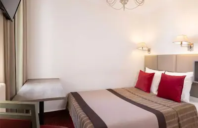 Un ou plusieurs lits dans un hébergement de l'établissement Hôtel Saint Pierre