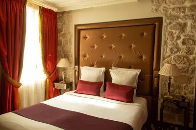 Un ou plusieurs lits dans un hébergement de l'établissement Hotel Du Beaumont