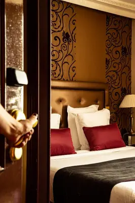 Un ou plusieurs lits dans un hébergement de l'établissement Hotel Du Beaumont