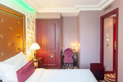 Un ou plusieurs lits dans un hébergement de l'établissement Hotel Du Beaumont